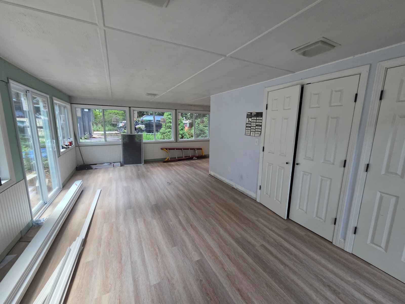 Bright room with large windows during renovation work